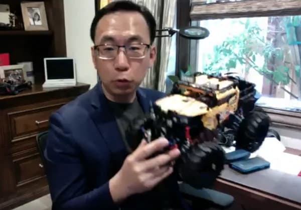 Dr Allen Yang Showing a Robot